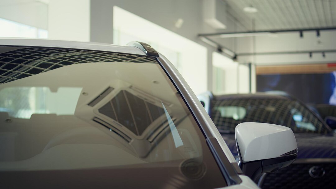 panning-shot-parked-vehicle-leather-black-seat-automobile-interior_482257-118327